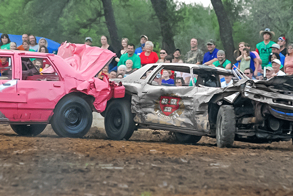 Demolition derby cars with Harvard crest
